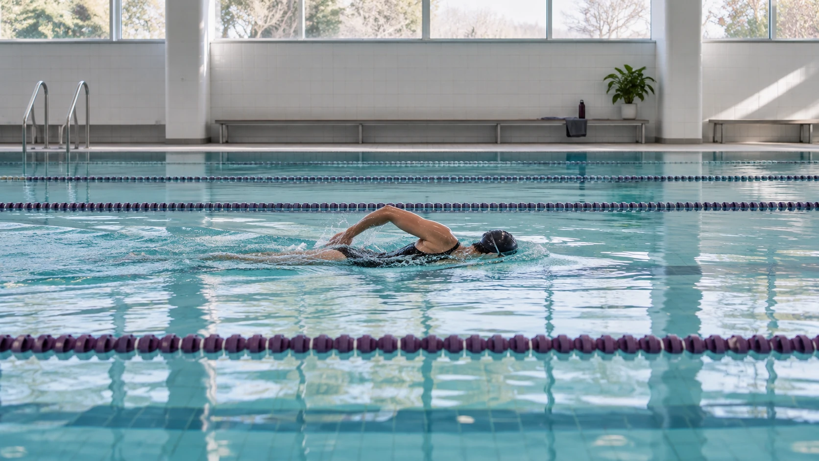 AI-generated concept: Adult swimmer moving steadily through a quiet indoor lap pool